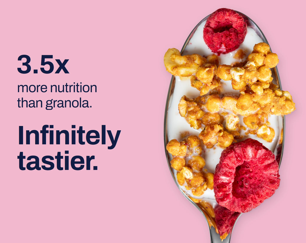 Raspberry Coconut granola on a spoon. 3.5x more nutrition than granola. Infinitely tastier.