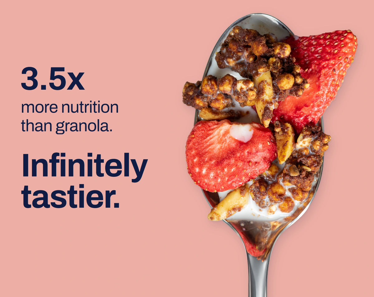 Strawberry Chocolate granola on a spoon. 3.5x more nutrition than granola. Infinitely tastier.