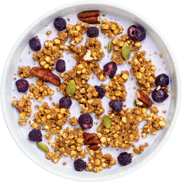 macronova blueberry granola with pecans and milk in a bowl
