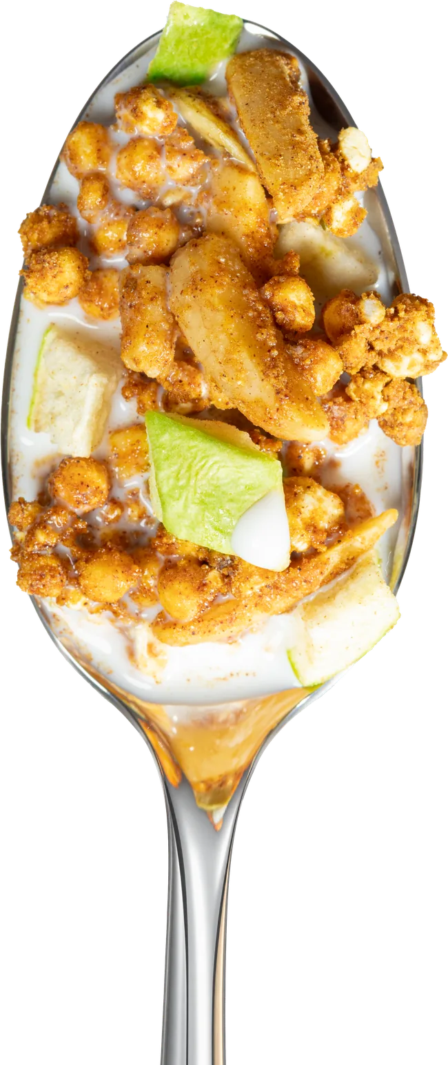 Green Apple Almond Cinnamon granola with milk on a spoon